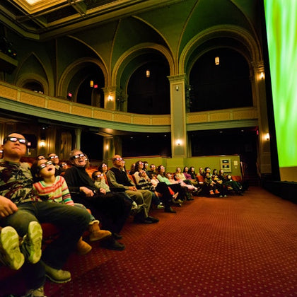 People enjoying a 4D show inside the American Museum of Natural History History.