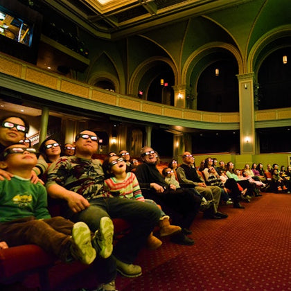 People enjoying a 4D show inside the American Museum of Natural History History.