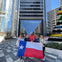 Pose for a group photo in front of the tallest building in the state
