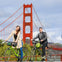 Two riders enjoy the Golden Gate Bridge