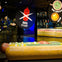 A giant model of a Chicago-style hot dog with a "No Ketchup" sign in a museum exhibit featuring various condiment displays.
