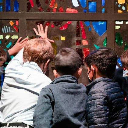Touching a stained glass window by Gabriel Loire