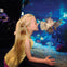 A young girl looking at a lionfish in an aquarium, with underwater scenery of rocks and corals visible in the background.
