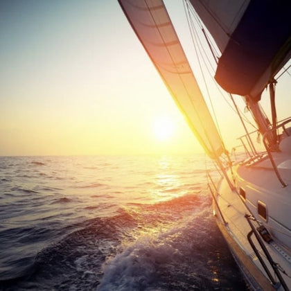 Sailboat sailing into the sunset