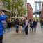 Tour guide taking photo of guests in Brooklyn, Bronx, Queens Bus Tour 