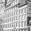 A vintage multi-story building with a sign reading 'Southern Hotel' and detailed architectural features.