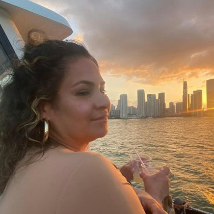 Enjoying a cocktail while the sun sets over the Miami Skyline