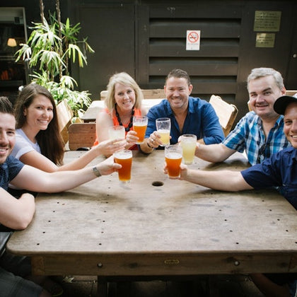 A group of guests enjoying a drink at a local pub