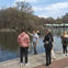 Chris showing the lake while row boats go by.