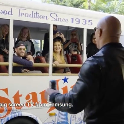 Dwayne "The Rock" Johnson giving guests a special treat