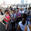 Capture the moment as our tour group listens to our guide's captivating stories on the Brooklyn Bridge.