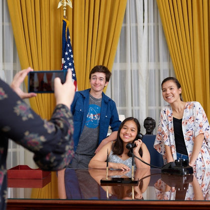 Take a photo behind the president’s desk! The Oval Office is designed in the original 1969 decor of California blue and gold.
