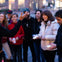 Tour guide making a tour group laugh while they hold EMF detectors, picking up on spiritual activity