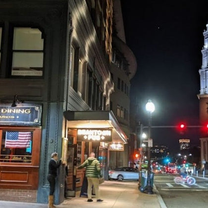 Nighttime photo from afar of the Beantown Pub