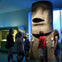 A group admiring an Easter Island moai inside the American Museum of Natural History in New York.