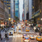 A busy city street with cars, taxis, and pedestrians. Buildings line both sides, and the scene is lively during dusk.
