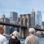 The cruise sails under the Brooklyn Bridge with views of Lower Manhattan