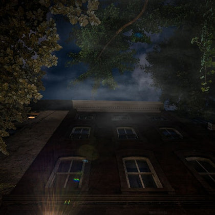 Nighttime photo of the House of Death in New York with a spooky clouds overhead