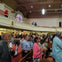 A snapshot of a tour guest immersed in the uplifting atmosphere of a Sunday church service.