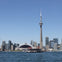 The Harbour Star cruising the inner Toronto Harbour. Toronto skyline in the background showing the CN Tower and Rogers Centre