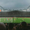 Audience watching Arsenal play from behind the goal