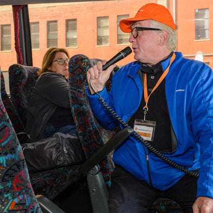 Tour Guide on Brooklyn, Bronx, Queens Bus Tour inside Bus