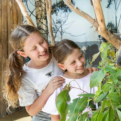 2 children taking photos at Koala Trail, the digital photos are provided for free.