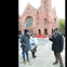A vibrant photo of our tour guide standing proudly in front of Harlem's iconic church.