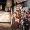 A museum exhibit displays historical protest photos and signs with messages about freedom of speech and opposition to Nazis.