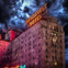 Nighttime photo of the Roosevelt Hotel in Los Angeles, with spooky clouds overhead