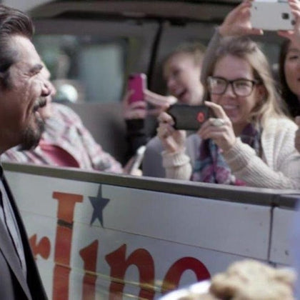George Lopez coming up to the guests on the Original Celebrity Homes Tour