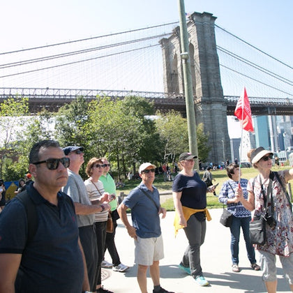 Capture a vibrant moment of our tour group exploring the charming streets of DUMBO.