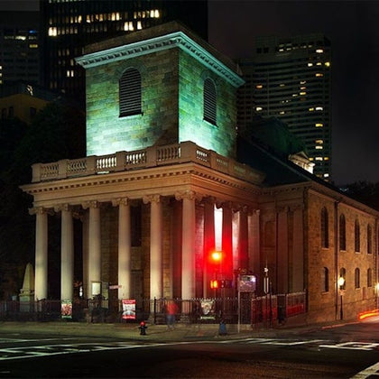 Nighttime photo of the King's Chapel Church in downtown Boston