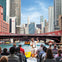 guide and tourists aboard a vessel on an architectural river and lake tour in chicago