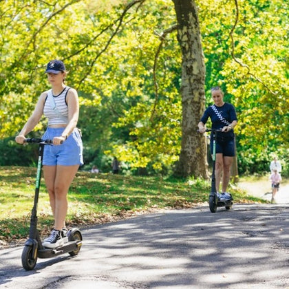 happy customers riding scooters