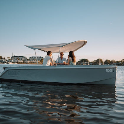 A GOBOAT sailing with three passages onboard 