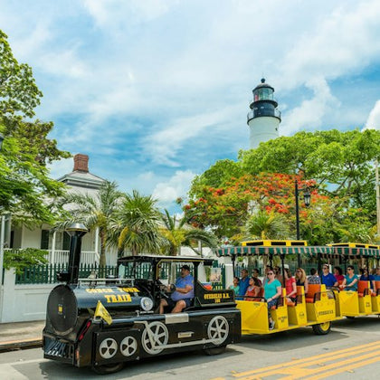 Conch Train passing by the Lighthouse