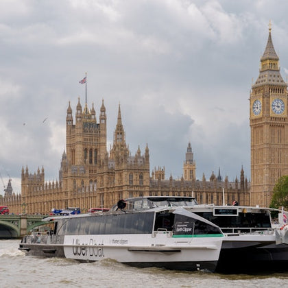 Uber Boat by Thames Clippers and The House of Parliament