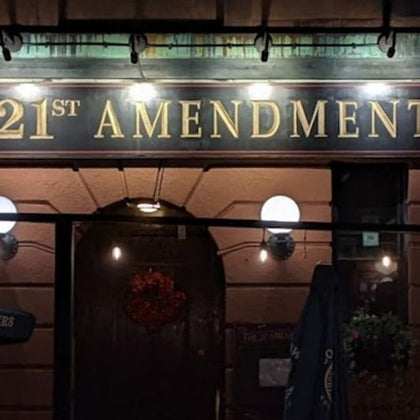 Nighttime entrance photo of the 21st Amendment