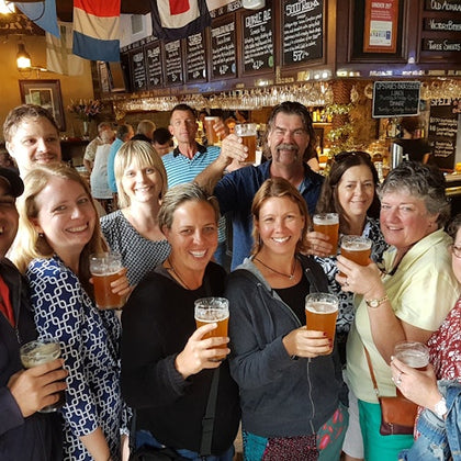 A group of guests enjoying a drink inside at The Lord Nelson Brewery Hotel