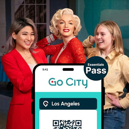 Three women posing together, one resembling Marilyn Monroe, with a Go City Essentials Pass for Los Angeles displayed in front.