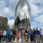 Friends pose alongside a famous art sculpture in Houston during the Astroville Best of Houston City Tour.