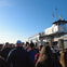 A vibrant photo of our tour group in front of the Statue of Liberty Ferry, ready for an unforgettable journey.