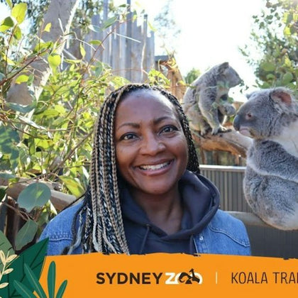 A girl taking photos at Koala Trial, the digital photos are provided for free.