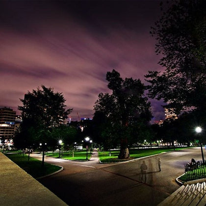 Nighttime photo of Boston Commons, with a spooky and mysterious sky.