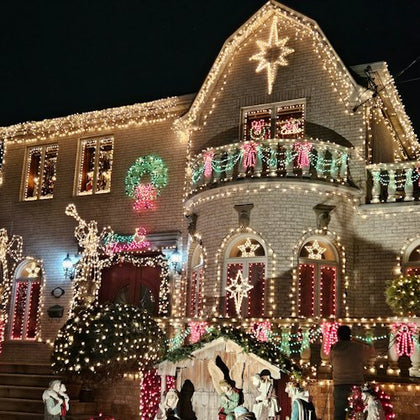 Fairy lights and a nativity scene decorate this house
