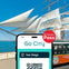A smartphone displaying a San Diego Go City pass in front of a sailing ship and a green trolley by the waterfront.