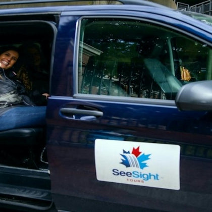 A guest in a See Sight Tours van.