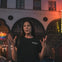 Tour guide expressing her hand while telling a story to her group