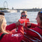 Enjoy a complimentary drink on board a Thames Rockets speedboat at sunset
